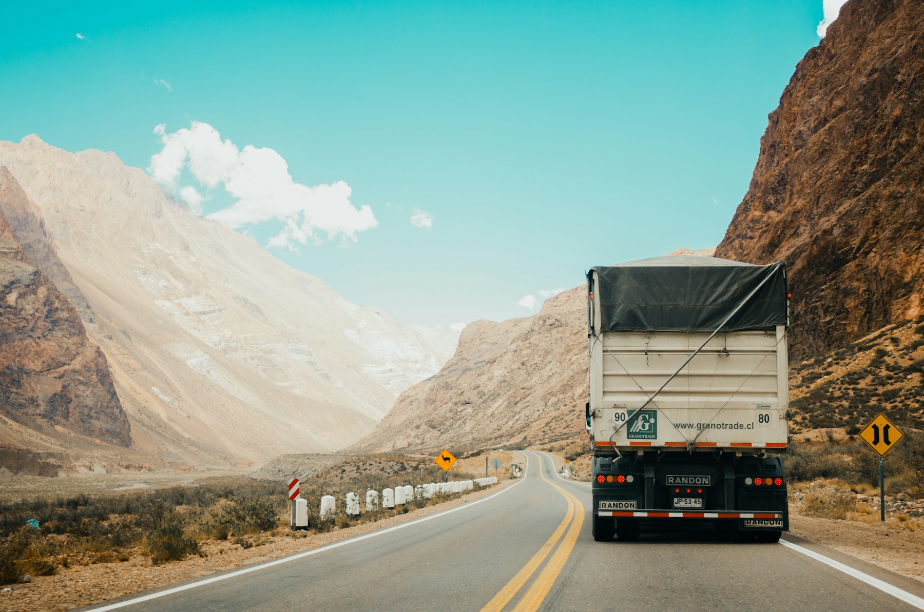 Semi truck carrying freight on an open highway